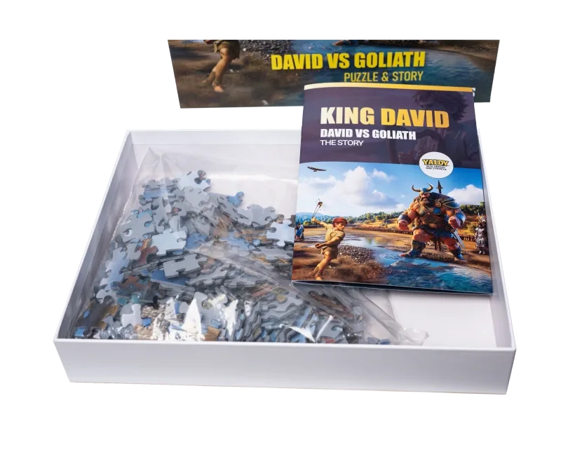 David vs Goliath puzzle - open box showing premium pieces and bilingual story flipbook