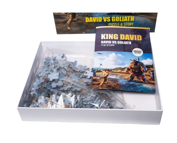 David vs Goliath puzzle - open box showing puzzle pieces and story flipbook inside